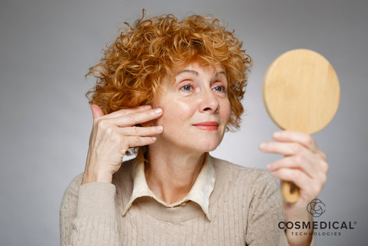 older woman touching face